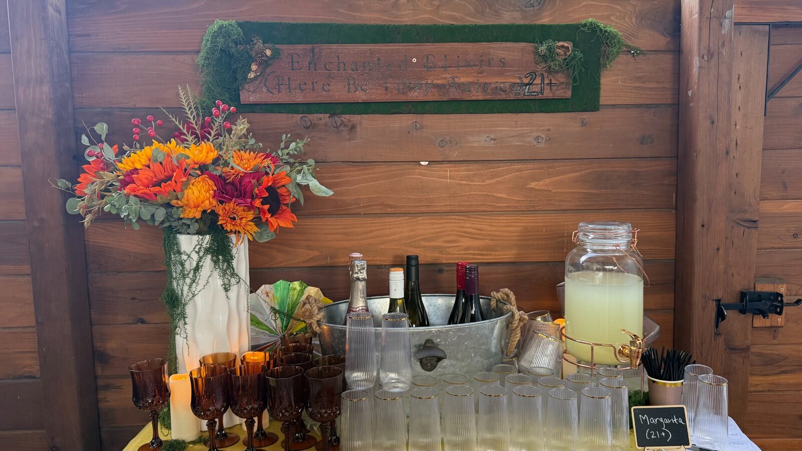 Styled outdoor beverage bar with floral details